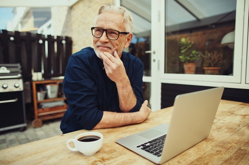 man brainstorming at his work desk